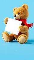 plush teddy bear holding a blank sign photo