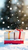 two gift boxes decorated with red gold ribbon sit the snow photo