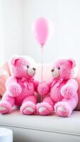 two pink teddy bears sharing a moment with a balloon photo
