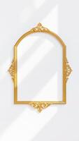 ornate gold frame against a white wall photo