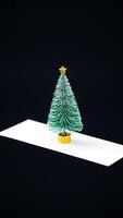 miniature artificial christmas tree with a star topper photo