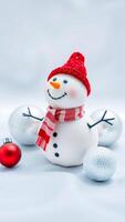 cheerful snowman decoration with red silver ornaments photo