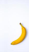 single ripe banana on a white background photo