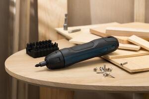 The image showcases a mini handheld cordless screwdriver, ideal for quick DIY tasks. photo