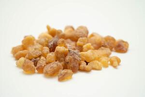 Frankincense or olibanum aromatic resin isolated on white background used in incense and perfumes. photo