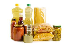 Foodstuffs in donation box isolated on white background with clipping path for volunteer to help people. photo
