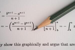 Pencil on mathematic formula exercise test paper in education school. photo