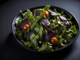 A black bowl filled with a salad with tomatoes and beets photo