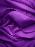 Purple fabric background with folds photo
