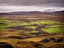 A view of a green landscape with hills and mountains photo
