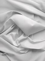 A white sheet of fabric with folds photo