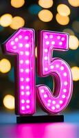 Luminous Number 15 With Led Lights Against Defocused Glowing Background For Birthday Or Anniversary photo