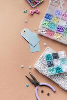 Creating personalized crafts with beads and tags on a light background for various DIY projects photo