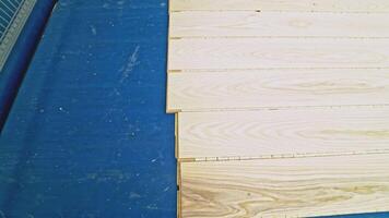Clean and smooth boards is going through all the processing steps for getting the final result of parquet for sale on the market. Close-up. video