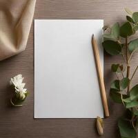 Pencil and a blank drawing paper on the desk photo