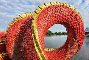 Red Body of Snake Statue or Naka Statue. photo