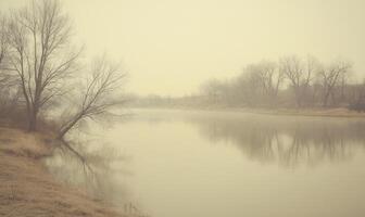 A foggy, misty day with a river in the background photo