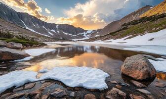 A beautiful mountain lake with a large rock in the foreground photo