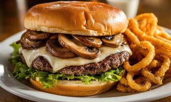A burger with mushrooms and onions on top of a bun photo