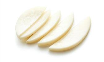 Four slices of white food on a white background photo