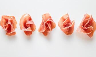 A row of meat slices are arranged in a line photo