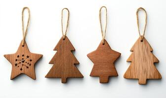 Four wooden Christmas tree ornaments hanging from a string photo