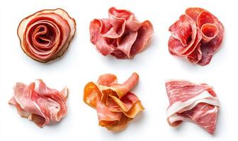 A variety of meats are displayed on a white background photo