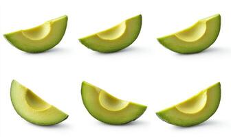 A close up of six avocado slices, each with a green stem photo