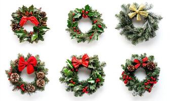 A collection of wreaths with red bows and pine cones photo