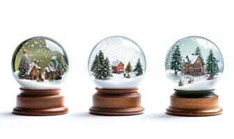 Three snow globes with houses and trees inside photo