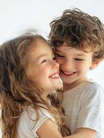 Two children are hugging each other and smiling photo
