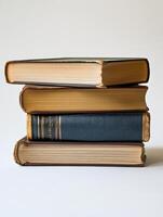 A stack of old books on a white background photo