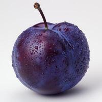 a purple apple with water droplets on it photo