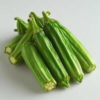 A collection of green vegetables with a focus on fava beans or fresh peas. These are small, photo