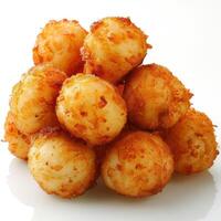 a pile of fried food sitting on top of a white table photo