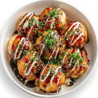a white bowl filled with food covered in sauce photo