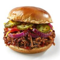 A barbecue sandwich garnished with pickles, jalapenos and cheese on a hoagie roll. photo