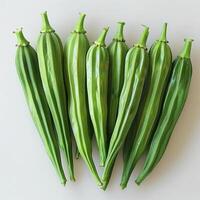 A bunch of green cucumbers lined up on a surface, showing their fresh and vibrant color. photo