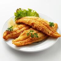 A plate of grilled fish fillets served with lemon wedge and dill for seasoning. photo