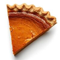A slice of a pumpkin pie with golden crust and orange filling. photo