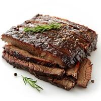 Freshly grilled ribs topped with herbs and spices photo