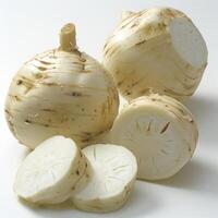 Several white squash bulbs on a table. They appear to be cut up, with some of the flesh removed. photo