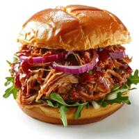 A delicious barbecue sandwich with onion rings, bacon, tomato and sour cream. photo