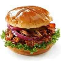 A delicious barbecue pulled pork sandwich topped with onions, cilantro, and sriracha sauce. photo