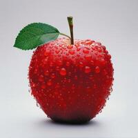 Red apple with raindrops forming a tear-drop pattern on its surface. photo