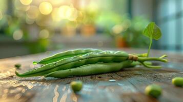 depicts a bunch of fresh green beans on a table, with water droplets around them, photo