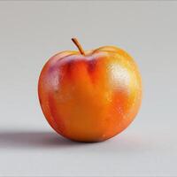 Fresh looking apple with a glossy shine and a few blemishes. photo