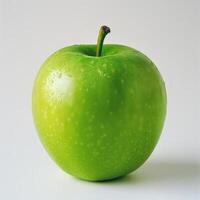 A single green apple with visible bruises and blemishes. photo
