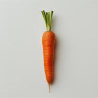 A whole carrot with its top still attached, leaning against a white background. photo