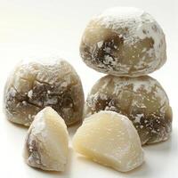 A collection of dried fruit, specifically lychee fruits, presented on a white surface. photo